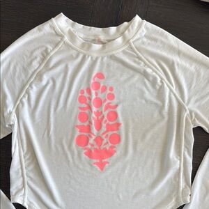 Free People Movement White Long Sleeve Shirt with Pink Graphic.